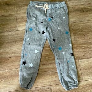 Gray sweatpants with pockets and White, Blue, Black stars.